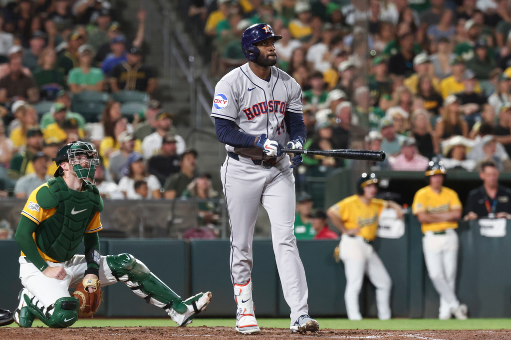 Houston Astros' Yordan Alvarez watches the ball after hitting a three-run home run during the fifth inning of a baseball game against the Athletics Saturday, Sept. 26, 2026, in West Sacramento, Calif. (AP Photo/Sara Nevis)