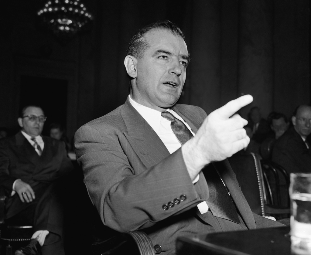 FILE - Sen. Joseph McCarthy gestures during a Senate subcommittee hearing in Washington, D.C., on McCarthy's charges of communist infiltration of the U.S. State Department, March 9, 1950. (AP Photo/Herbert K. White, File)