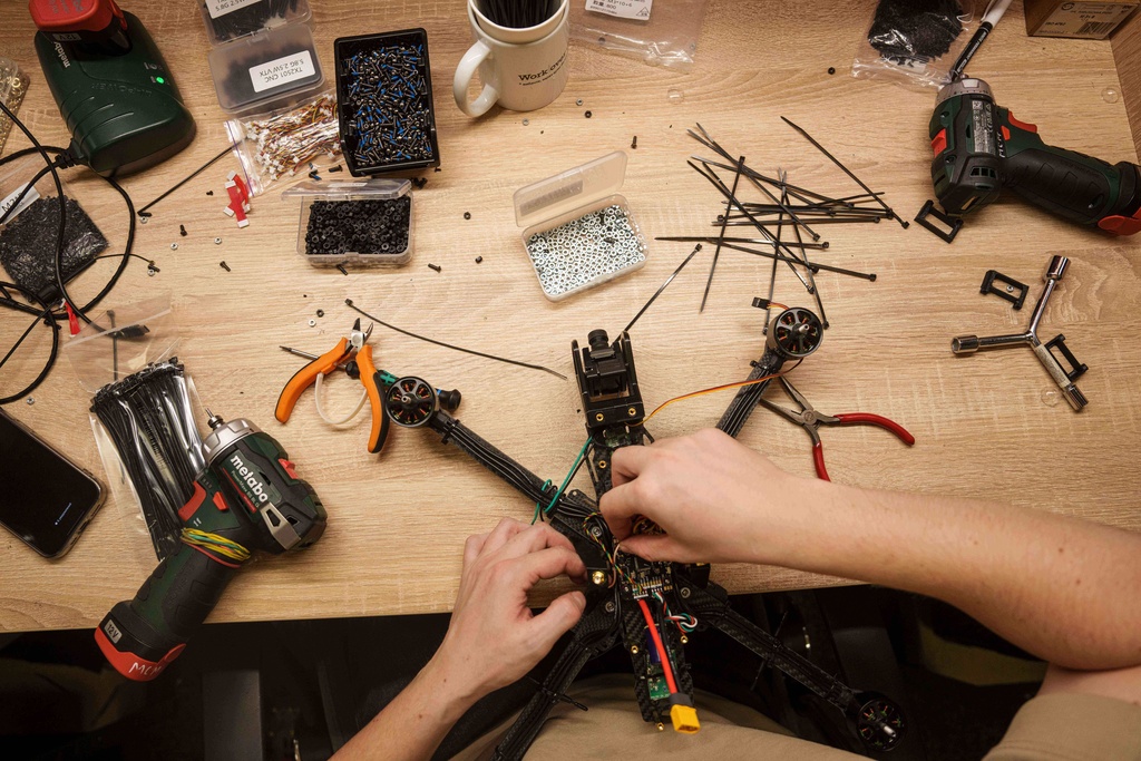 An engineer collects FPV drones of "General Cherry" company at the workshop in Ukraine, on Dec. 4, 2025. (AP Photo/Evgeniy Maloletka)