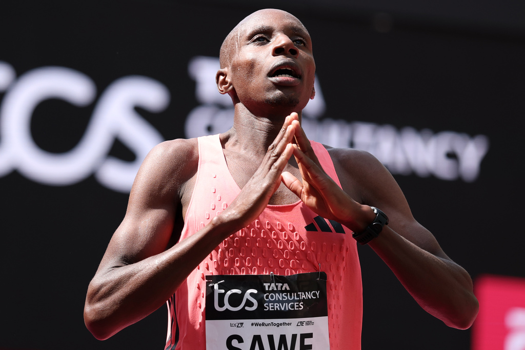 Sebastian Sawe from Kenya celebrates winning the men's race at the London Marathon in London, Sunday, April 26, 2026.(AP Photo/Ian Walton)