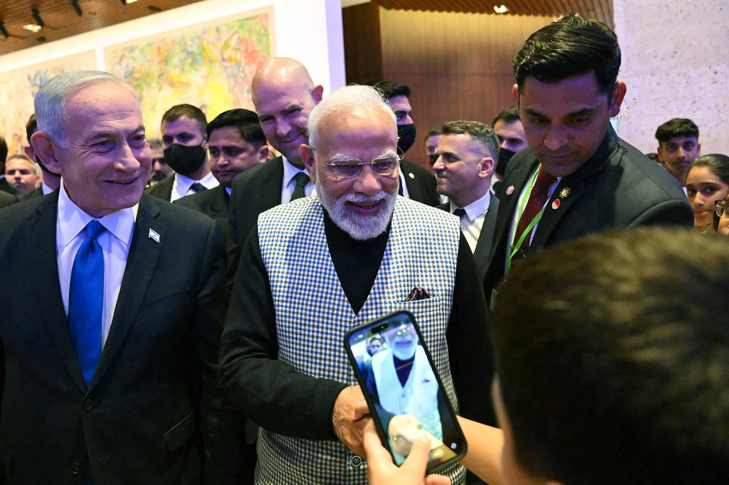 Israeli Prime Minister Benjamin Netanyahu and Indian Prime Minister Narendra Modi greet children in the Knesset, Israel's parliament, in Jerusalem, Wednesday, Feb. 25, 2026. (Debbie Hill/Pool Photo via AP)