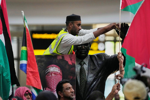 Activists prepare to welcome of members of the Global Sumud Flotilla, at OR Tambo International Airport, in Johannesburg, South Africa, Wednesday, Oct. 8, 2025. (AP Photo/Themba Hadebe) Activists prepare to welcome of members of the Global Sumud Flotilla, at OR Tambo International Airport, in Johannesburg, South Africa, Wednesday, Oct. 8, 2025. (AP Photo/Themba Hadebe)