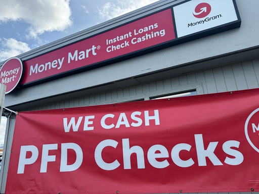 A sign advertising the cashing of Alaska Permanent Fund Dividend, or PFD, checks hangs outside a business in Anchorage, Alaska, Tuesday, Sept. 23, 2025. (AP Photo/Mark Thiessen) A sign advertising the cashing of Alaska Permanent Fund Dividend, or PFD, checks hangs outside a business in Anchorage, Alaska, Tuesday, Sept. 23, 2025. (AP Photo/Mark Thiessen)