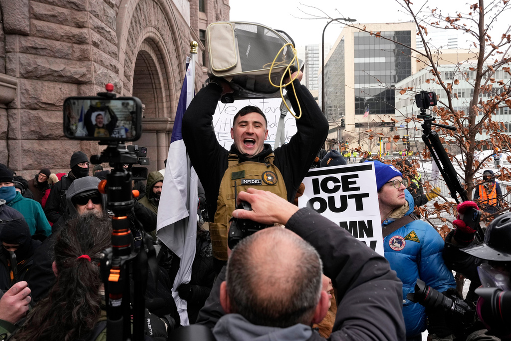 Jake Lang, who organized the protest March Against Minnesota Fraud, attends the rally in front of Minneapolis City Hall, Saturday, Jan. 17, 2026, in Minneapolis. (AP Photo/Yuki Iwamura)