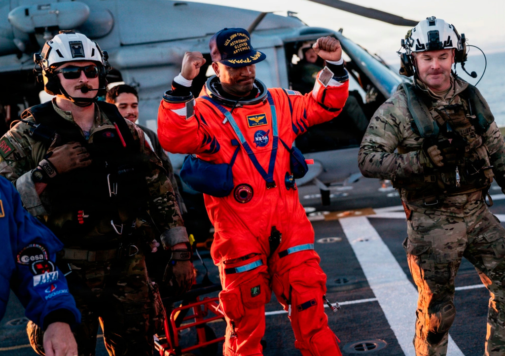 This photo provided by the U.S. Navy, NASA astronaut Victor Glover celebrates on the flight deck of the USS John P. Murtha (LPD 26) off the coast of California after returning from space on Friday, April 10, 2026.(Mass Communication Specialist 2nd Class August Clawson/U.S. Navy via AP)