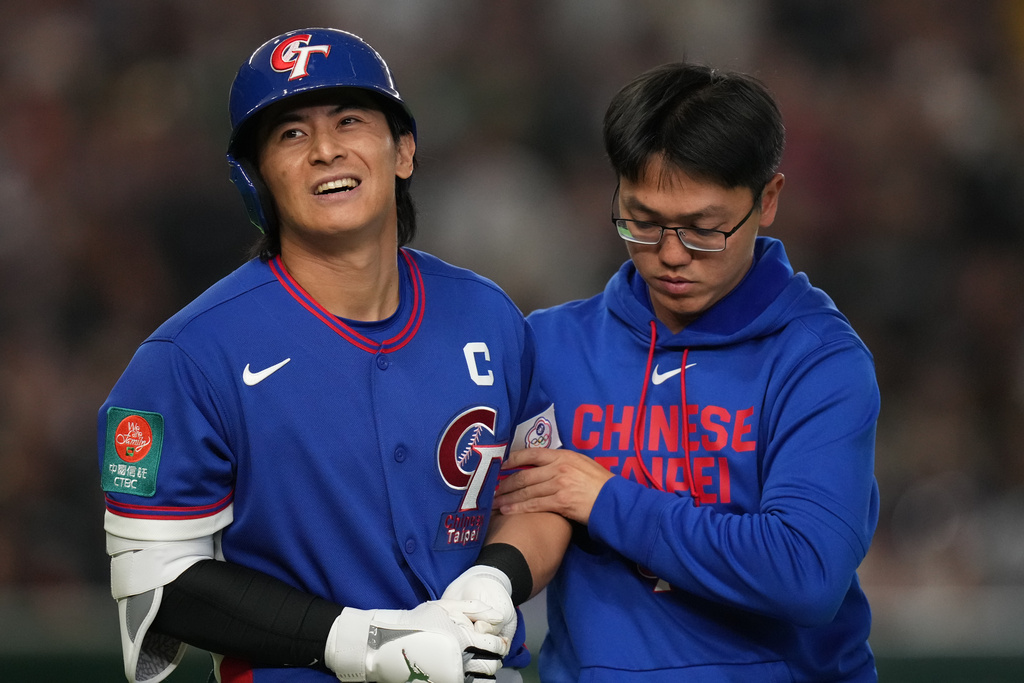 Taiwan's Chen Chieh-hsien reacts after getting hit by a pitch by Australia's pitcher Jack O'Loughlin in the sixth inning of a World Baseball Classic game in Tokyo, Thursday, March 5, 2026. (AP Photo/Hiro Komae)