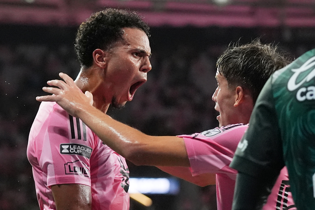 Inter Miami defender Ian Fray, left, reacts after forward Daniel Pinter, right, scored a goal during the first half of a Leagues Cup soccer match against Club León, Wednesday, Aug. 12, 2026, in Miami. (AP Photo/Lynne Sladky)