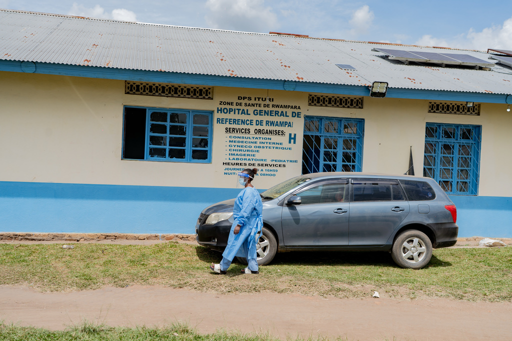A health worker wearing protective gear walks outside the a hospital in Bunia, Congo, Saturday, May 16, 2026. (AP Photo/Jorkim Jotham Pituwa)