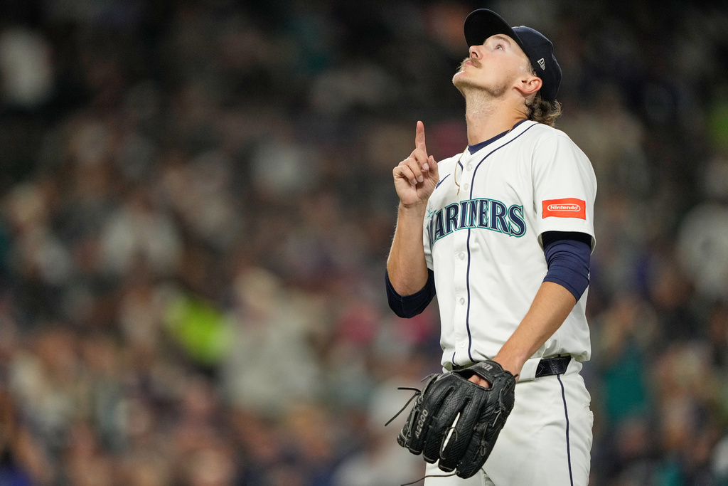 Seattle Mariners starting pitcher Bryce Miller reacts while walking back to the dugout after being relieved during the sixth inning of a baseball game against the Colorado Rockies, Tuesday, Sept. 23, 2025, in Seattle. (AP Photo/Ryan Sun)