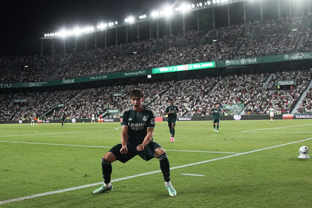 Real Madrid's Carlos Espi celebrates after scoring his sides third goal during the Spanish La Liga soccer match between Elche and Real Madrid in Elche, Spain, Tuesday, Sept. 15, 2026. (AP Photo/Alberto Saiz)