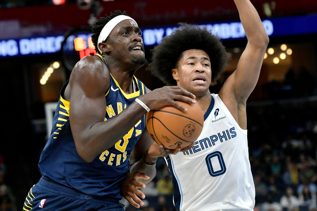 Indiana Pacers forward Pascal Siakam drives against Memphis Grizzlies forward Jaylen Wells (0) in the first half of an NBA basketball game, Saturday, Oct. 25, 2025, in Memphis, Tenn. (AP Photo/Brandon Dill)