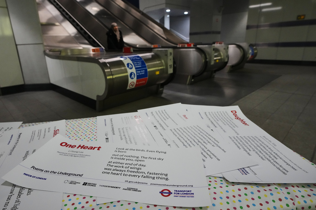 Poems are laid out on a table at a gathering to celebrate 40 years of 'Poems on the Underground' in London, Friday, Jan. 30, 2026. (AP Photo/Kirsty Wigglesworth)