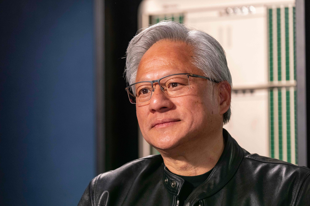 Jensen Huang, president and CEO of Nvidia, listens during an interview before a groundbreaking ceremony for an expansion of Coherent's manufacturing facility on Tuesday, June 16, 2026, in Sherman, Texas. (AP Photo/Jeffrey McWhorter)