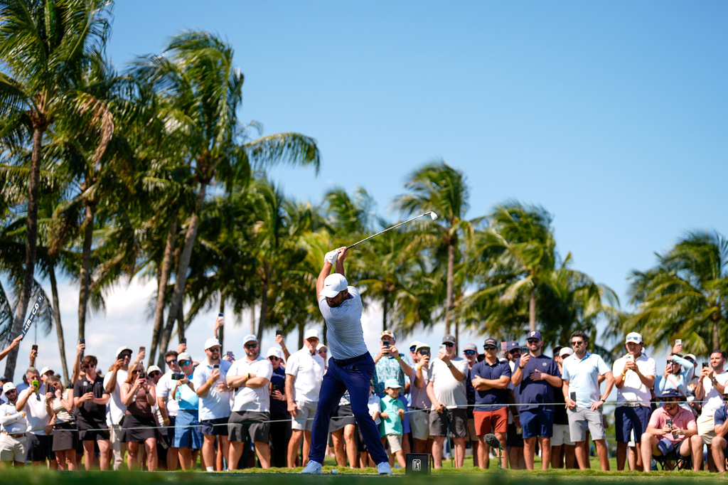 Scottie Scheffler hits from the ninth tee during the second round of the Cadillac Championship PGA golf tournament Friday, May 1, 2026, in Doral, Fla. (AP Photo/David J. Phillip)