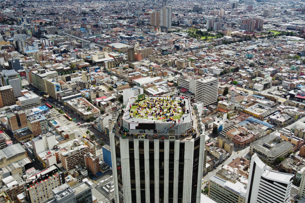Fans watch the World Cup round of 16 soccer match between Colombia and Switzerland on a terrace rooftop in Bogota, Colombia, Tuesday, July 7, 2026. (AP Photo/Sebastian Barros)