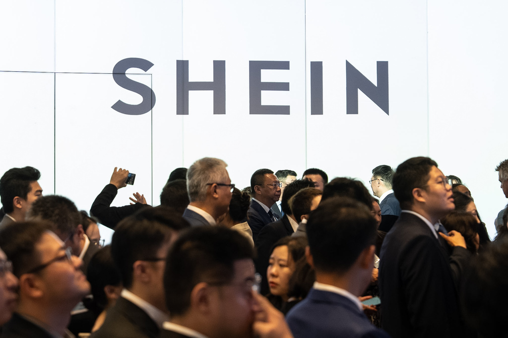 A logo of fast-fashion online retailer Shein is displayed at the listing ceremony in Hong Kong, Tuesday, Sept. 1, 2026. (AP Photo/Chan Long Hei)