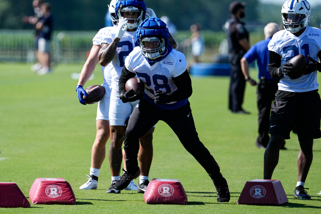 Indianapolis Colts running back Jonathan Taylor (28) runs a drill during practice at the NFL football team's training camp in Westfield, Ind., Thursday, July 30, 2026. (AP Photo/Michael Conroy)