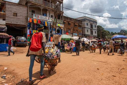 A man pushes a wheelbarrow loaded with goods through Mokolo market, Yaoundé, Cameroon, Sept. 12, 2025. (AP Photo / Welba Yamo Pascal) A man pushes a wheelbarrow loaded with goods through Mokolo market, Yaoundé, Cameroon, Sept. 12, 2025. (AP Photo / Welba Yamo Pascal)