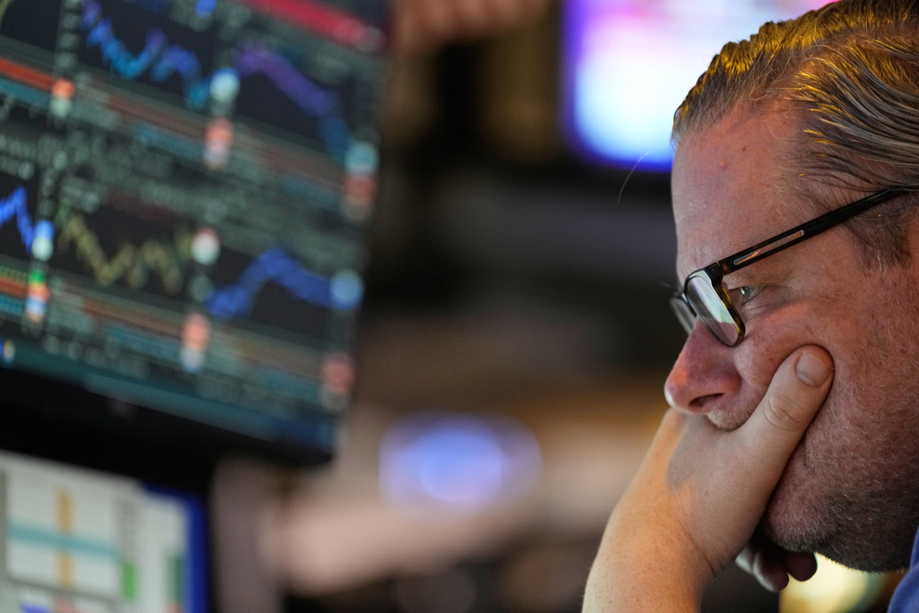 Gregg Maloney works on the floor at the New York Stock Exchange in New York, Wednesday, Dec. 10, 2025. (AP Photo/Seth Wenig)