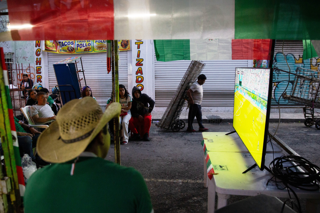 Mexico soccer fans watch a World Cup match between Mexico and South Korea in the Tepito neighborhood of Mexico City, Thursday, June 18, 2026. (AP Photo/Megan Janetsky)