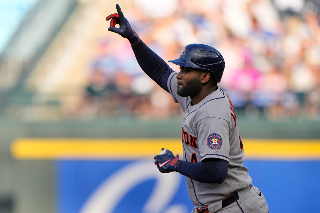 Houston Astros' Yordan Alvarez celebrates after hitting a two-run home run during the first inning of a baseball game against the Kansas City Royals, Friday, June 12, 2026, in Kansas City, Mo. (AP Photo/Charlie Riedel)