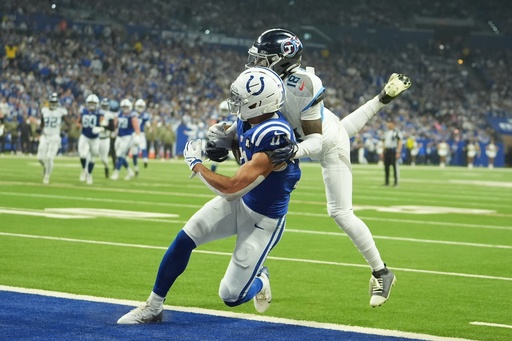 Indianapolis Colts wide receiver Michael Pittman Jr. (11) makes a touchdown catch against Tennessee Titans cornerback Jalyn Armour-Davis (18) during the first half an NFL football game, Sunday, Oct. 26, 2025, in Indianapolis. (AP Photo/Michael Conroy) Indianapolis Colts wide receiver Michael Pittman Jr. (11) makes a touchdown catch against Tennessee Titans cornerback Jalyn Armour-Davis (18) during the first half an NFL football game, Sunday, Oct. 26, 2025, in Indianapolis. (AP Photo/Michael Conroy)