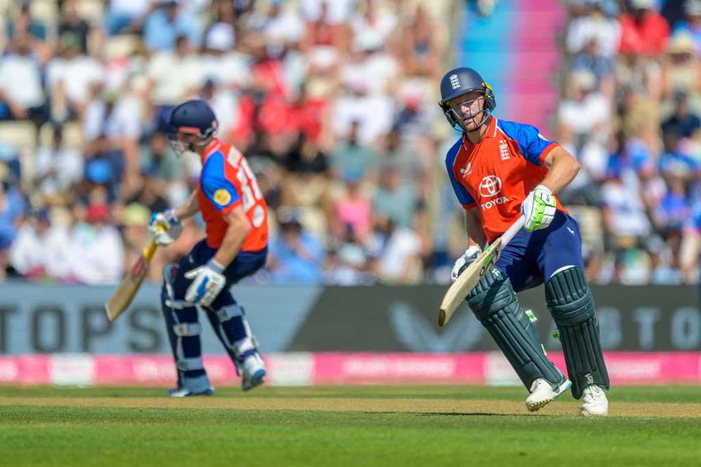 England's Harry Brook, left, and Jos Buttler during the international T20 Cricket match between England and India in Southampton, England, Saturday, July 11, 2026. (AP Photo/Anthony Upton)