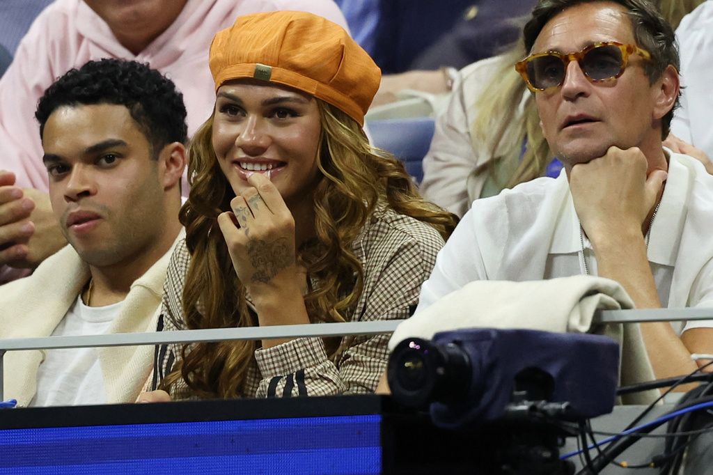 American soccer player Trinity Rodman, center, watches her boyfriend Ben Shelton, of the United States, play Carlos Alcaraz, of Spain, in the quarterfinal round of the U.S. Open tennis championships, Tuesday, Sept. 8, 2026, in New York.(AP Photo/Heather Khalifa)