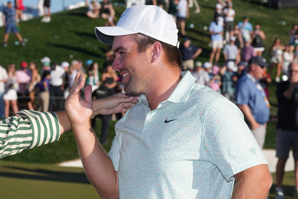 Chris Gotterup smiles at the 18th green after his playoff win in final round of the Phoenix Open golf tournament Sunday, Feb. 8, 2026, in Scottsdale, Ariz. (AP Photo/Ross D. Franklin)