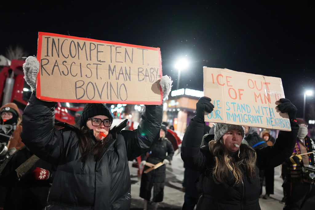 Demonstrators make noise during a protest outside a SpringHill Suites and Residence Inn by Marriott hotels on Monday, Jan. 26, 2026, in Maple Grove, Minn. (AP Photo/Adam Gray)