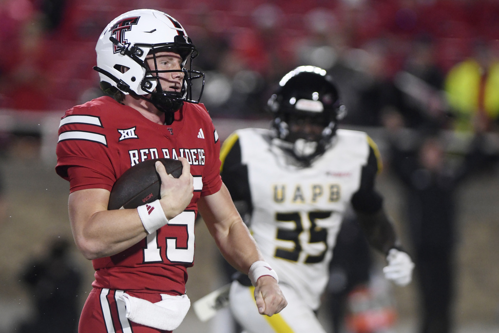 Texas Tech quarterback Will Hammond (15) runs for a touchdown during the second half of an NCAA college football game against Arkansas-Pine Bluff, Saturday, Aug. 30, 2025, in Lubbock, Texas. (AP Photo/Annie Rice)