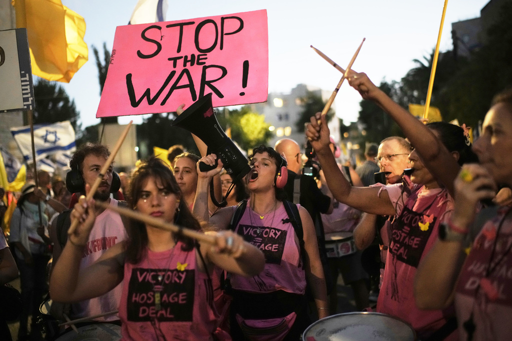 FILE - People take part in a protest demanding the immediate release of all hostages held by Hamas and calling for the end to the war in Gaza, in Jerusalem, Wednesday, Sept. 3, 2025. (AP Photo/Leo Correa, File)