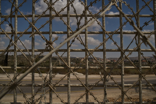 The town of Turmus Ayya is seen through a fence built by Israeli authorities that surrounds the West Bank village of Sinjil, Tuesday, Sept. 30, 2025. (AP Photo/Leo Correa) The town of Turmus Ayya is seen through a fence built by Israeli authorities that surrounds the West Bank village of Sinjil, Tuesday, Sept. 30, 2025. (AP Photo/Leo Correa)