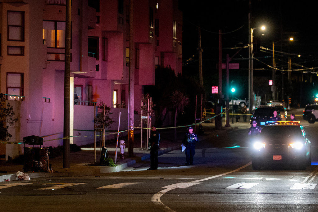 Officers with the San Francisco Police Department investigate the scene of a shooting near Ocean Beach in San Francisco, Saturday, Nov. 8, 2025. (Stephen Lam/San Francisco Chronicle via AP)