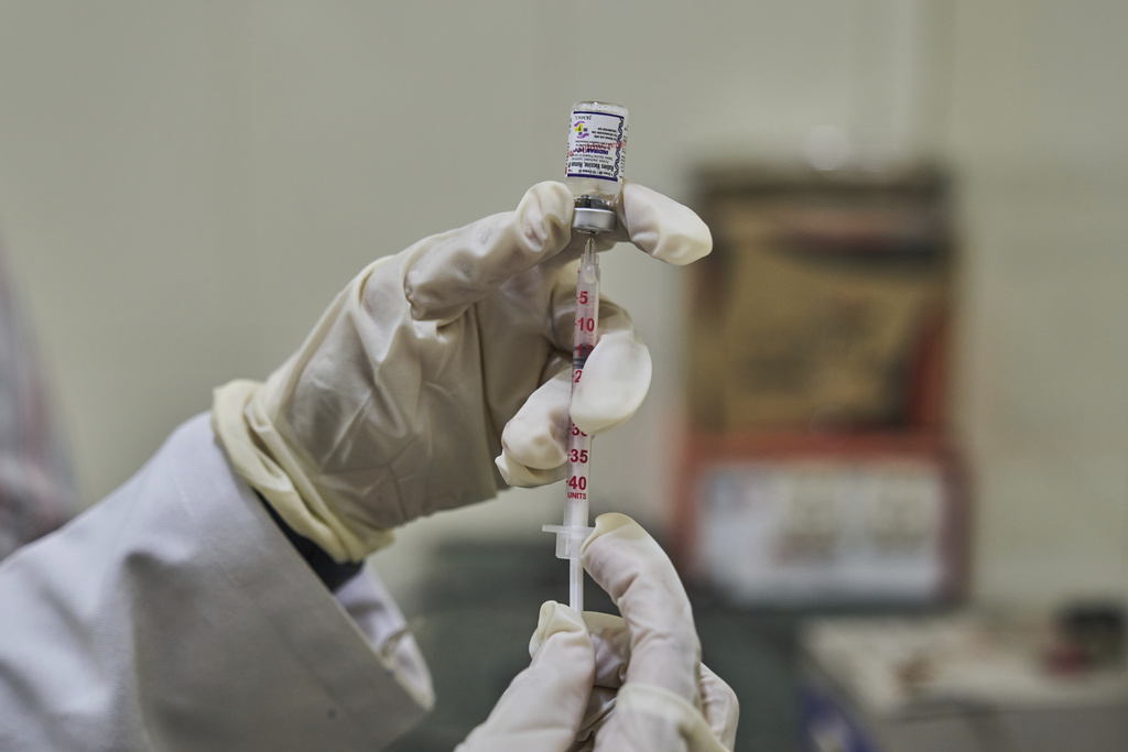 A Veterinarian prepares to administer a vaccine at the anti-rabies clinic at a hospital in Srinagar, Indian controlled Kashmir, Thursday, Sept. 18, 2025. (AP Photo/Dar Yasin)