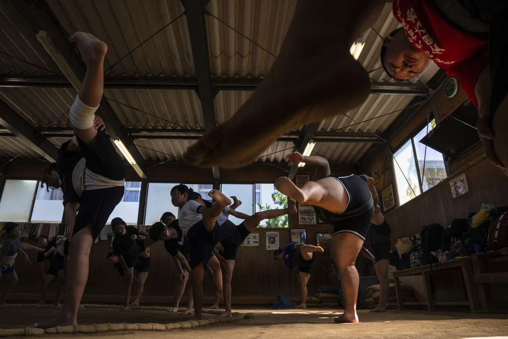 Wrestlers train during a practice session at a sumo camp in Tottori Johoku High School in Tottori, Japan, on July 29, 2025. (AP Photo/Louise Delmotte)