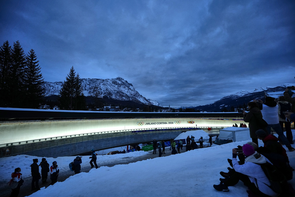 Germany's Merle Malou Fraebel slides down the track during a women's single luge run at the 2026 Winter Olympics, in Cortina d'Ampezzo, Italy, Monday, Feb. 9, 2026. (AP Photo/Alessandra Tarantino)
