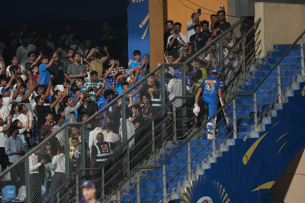 Mumbai Indians' Rohit Sharma walks back to dressing room after loosing his wicket during the Indian Premier League cricket match between Mumbai Indians and Kolkata Knight Riders in Mumbai, India, Sunday, March 29, 2026. (AP Photo/Rafiq Maqbool)