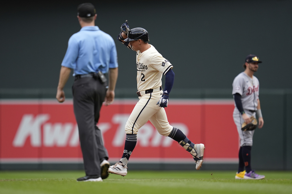 Minnesota Twins' Brooks Lee (2) runs the bases after hitting a grand slam during the third inning of a baseball game against the Detroit Tigers, Sunday, Aug. 17, 2025, in Minneapolis. (AP Photo/Abbie Parr)