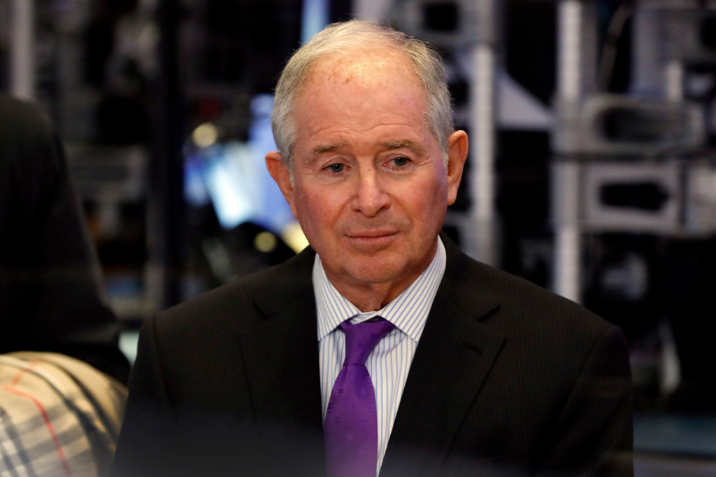 FILE - Stephen Schwarzman, chairman, CEO and co-founder of the investment firm Blackstone, waits to be interviewed on the floor of the New York Stock Exchange, Tuesday, Oct. 8, 2019. (AP Photo/Richard Drew, File)