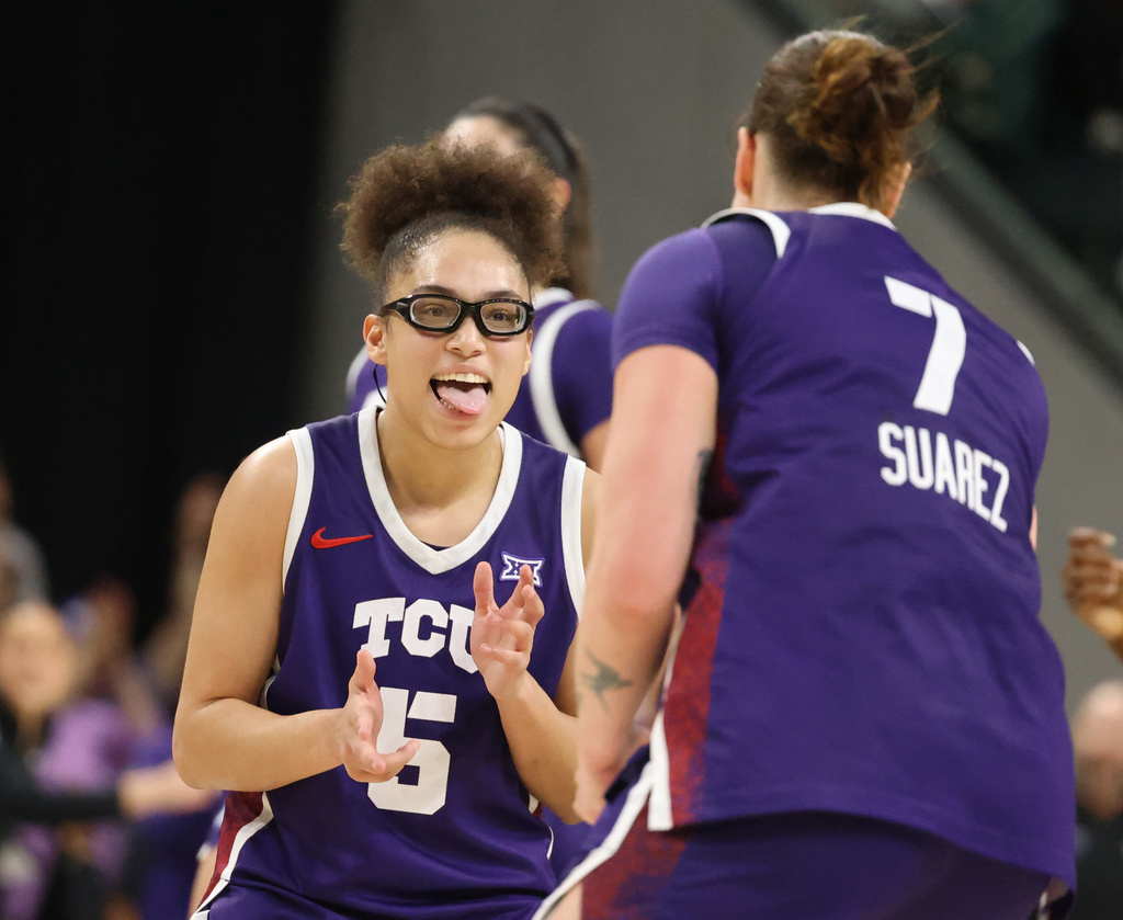 TCU guard Olivia Miles, left, reacts to forward Marta Su&aacute;rez 3-point play against Baylor in the second half of an NCAA college basketball game, Thursday, Feb. 12, 2026, in Waco, Texas. (Rod Aydelotte/Waco Tribune-Herald via AP)