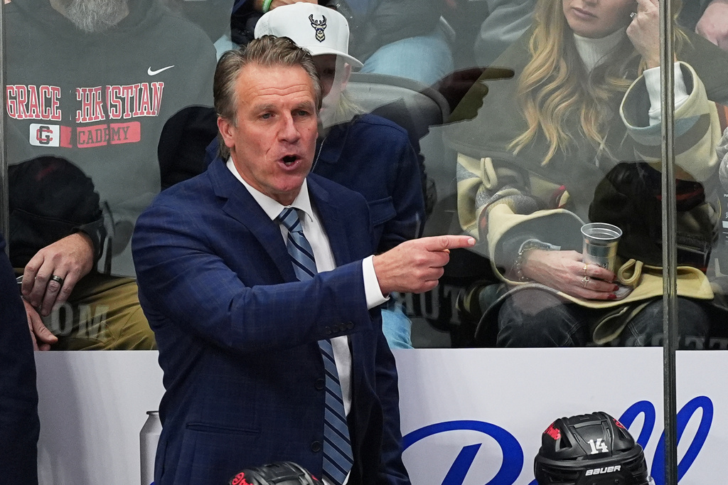 FILE - Los Angeles Kings head coach Jim Hiller directs his players from the team box in the third period of an NHL hockey game against the Colorado Avalanche Dec. 29, 2025, in Denver. (AP Photo/David Zalubowski, File)