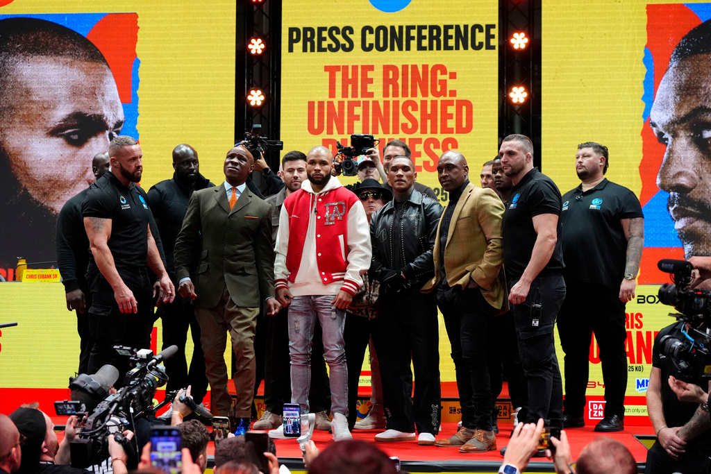 Chris Eubank Sr with father Chris Eubank Jr and Conor Benn with father Nigel Benn during a press conference at The Pelligon, London, Thursday Nov. 13, 2025. (Nick Potts/PA via AP)