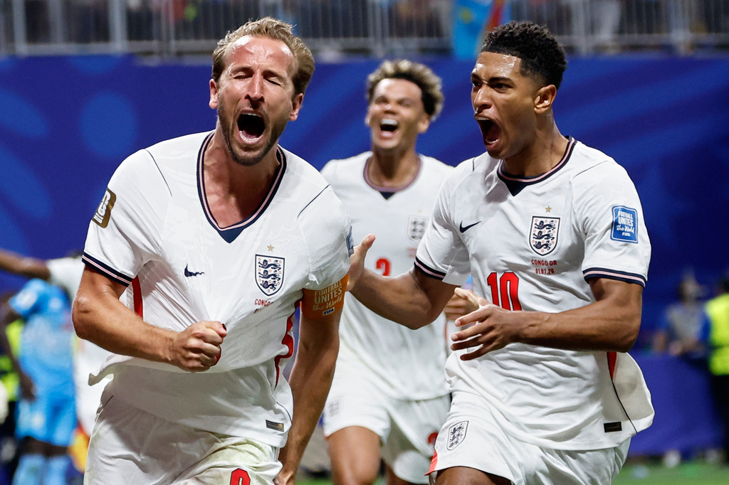 England's Harry Kane (9) celebrates after scoring his side's first goal next to his teammate Jude Bellingham (10) during the World Cup round of 32 soccer match between England and Congo in Atlanta, Wednesday, July 1, 2026. (AP Photo/Butch Dill)