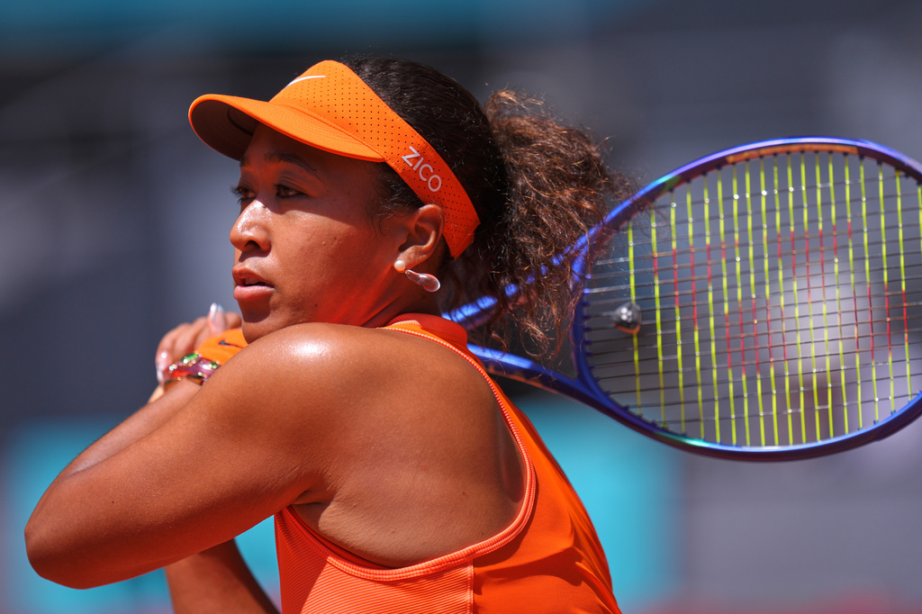Naomi Osaka of Japan returns the ball to Aryna Sabalenka of Belarus during the Madrid Open tennis tournament in Madrid, Monday, April 27, 2026. (AP Photo/Manu Fernandez)