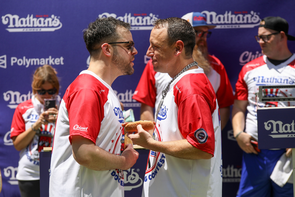 Patrick Bertoletti, left, and Joey Chestnut participate in the Nathan's Famous Fourth of July International Hot Dog Eating Contest weigh-in ceremony at Hudson Yards on Friday, July 3, 2026, in New York. (Photo by Andy Kropa/Invision/AP)