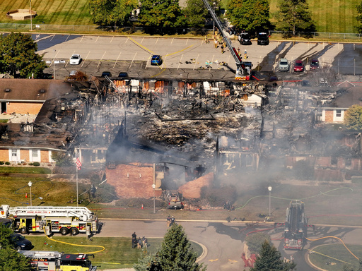 Emergency crews respond to a shooting and fire at The Church of Jesus Christ of Latter-day Saints, in Grand Blanc, Mich., Sept. 28, 2025. (David Guralnick/Detroit News via AP) Emergency crews respond to a shooting and fire at The Church of Jesus Christ of Latter-day Saints, in Grand Blanc, Mich., Sept. 28, 2025. (David Guralnick/Detroit News via AP)