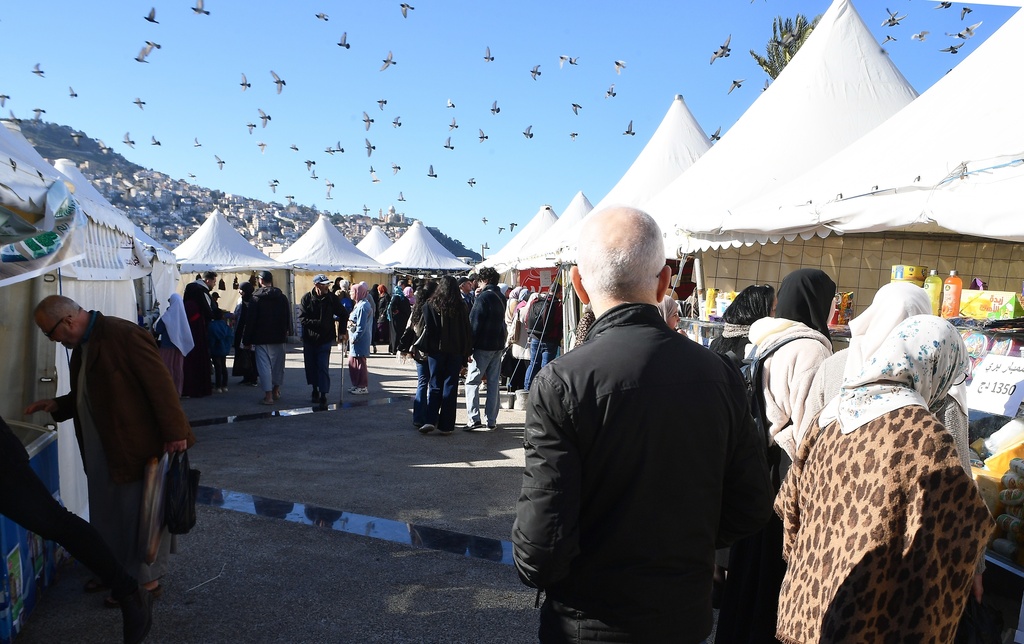 People walk at a market in Algiers, Algeria, Thursday, Feb. 17, 2026. (AP Photo/Fateh Guidoum)