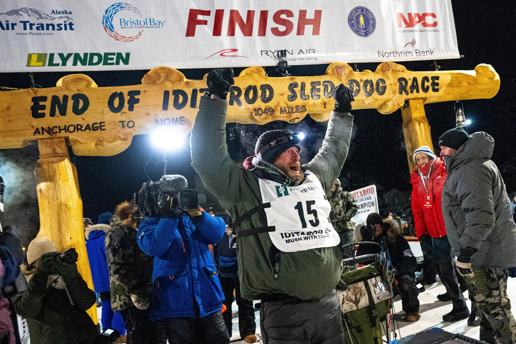 FILE - Jessie Holmes celebrates after winning the Iditarod Trail Sled Dog Race, March 14, 2025, in Nome, Alaska. (Loren Holmes/Anchorage Daily News via AP, File)
