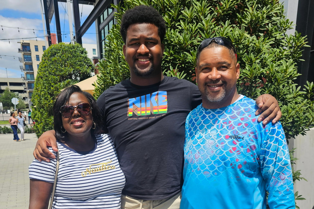 Calvin Dickey Jr., center, poses for a photo with his father, Calvin Dickey Sr., and mother, Nicole Dickey, in Tampa, Fla., on March 31, 2024. (Courtesy of Calvin Dickey Sr. via AP)